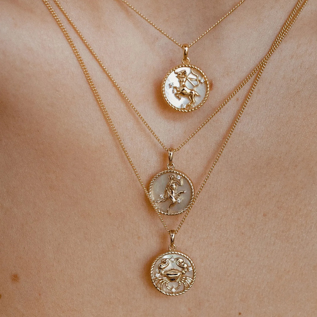 Zodiac Celestial Symbol Pendant with Chain – worn by a model