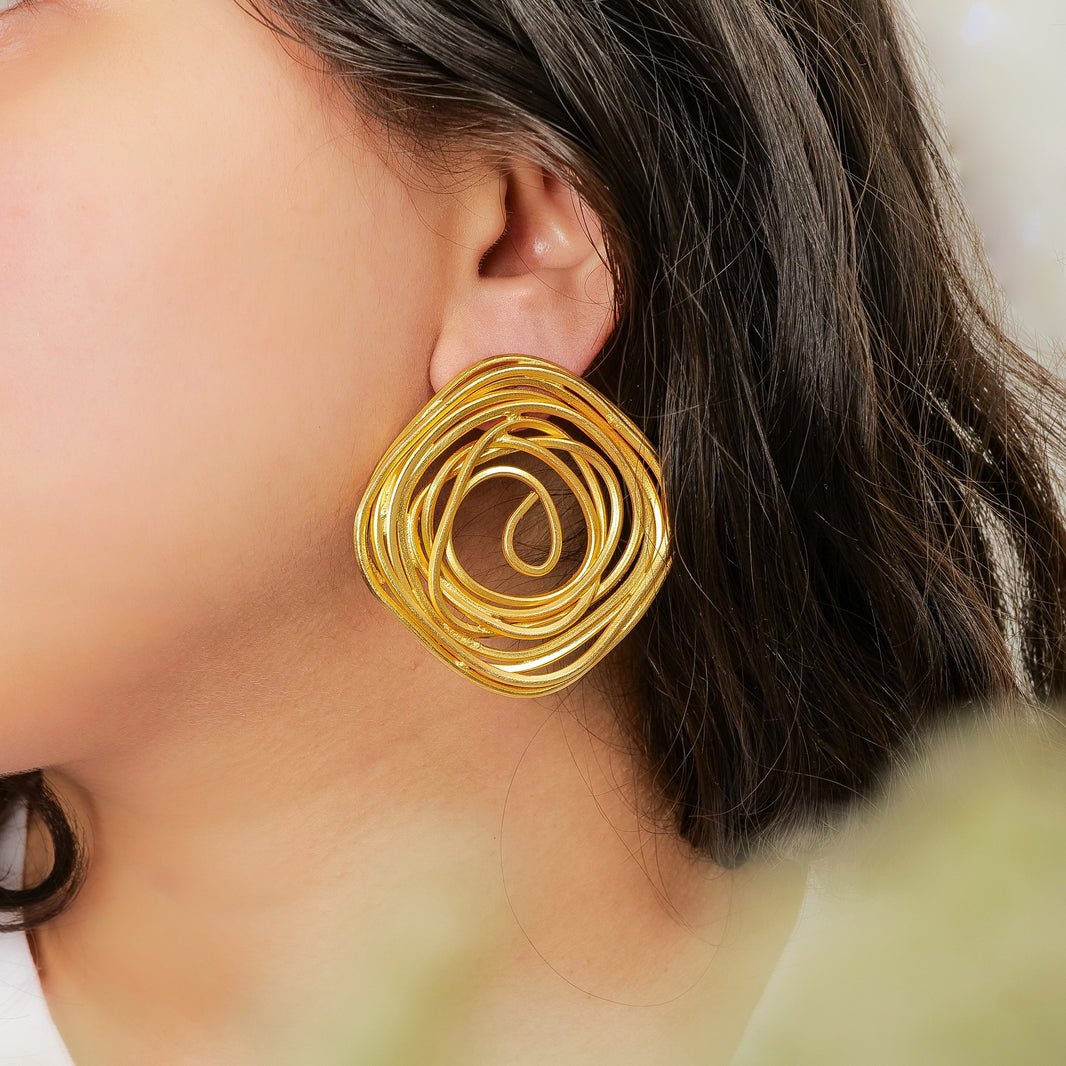 Spiral Rose Studs – worn by a model